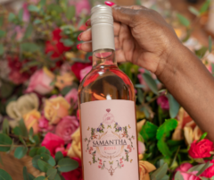 Samantha rose wine in front of flowers